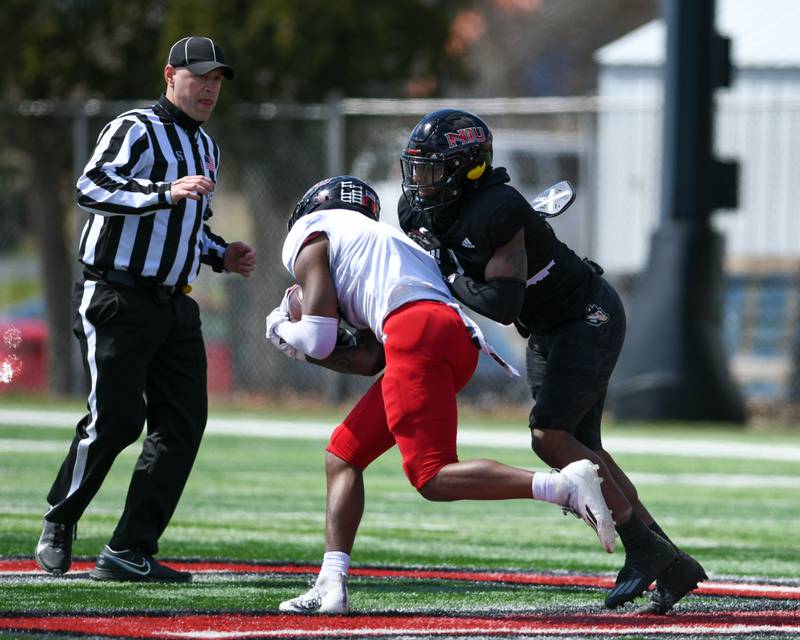 Northern Illinois University safety Devin Lafayette, right, stops Northern Illinois University wide receiver Tyrice Richie during a spring scrimmage on Saturday April 16th held at Huskie Stadium in DeKalb.