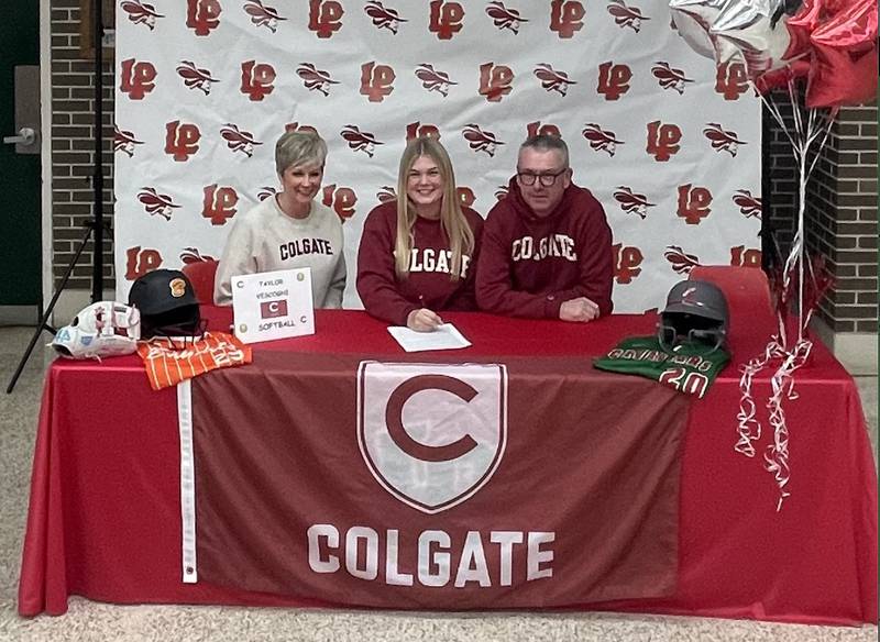 La Salle-Peru senior Taylor Vescogni (center) signed to play softball at Colgate University. She was joined by her parents, Shelly and Brian.