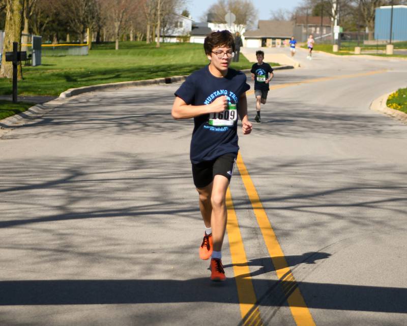 Ethan Turner of Downers Grove finishes the Mustang Trot race on Sunday April 14, 2024, held at Downers Grove South High School.