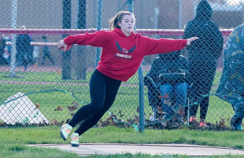 Yorkville’s Courtney Clabough competes in the Discus during the Matt Wulf Invitational track and field meet at Yorkville High School on Thursday, April 14, 2022.