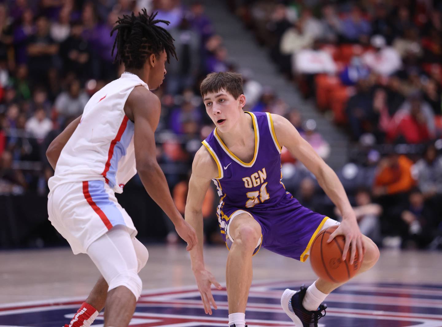 Downers Grove North's Jack Stanton (21) plans his attack during the boys 4A super-sectional game between Kenwood Academy and Downers Grove North high school in Chicago on Monday, March 6, 2023.