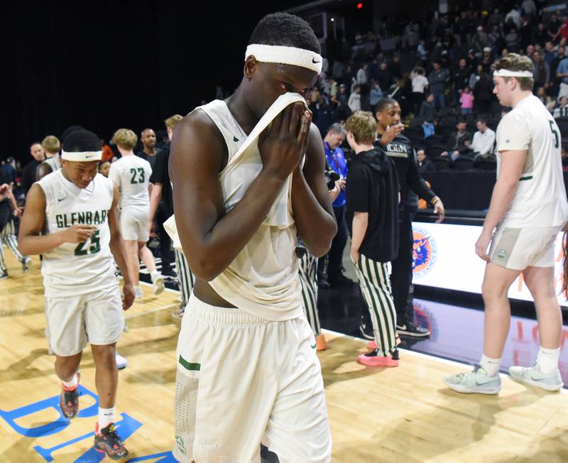 Glenbard West's Josh Abushanab leaves the court after the Hilltoppers lost to Evanston 47-43 during the Class 4A boys supersectional at NOW Arena on Monday, March 10, 2025 in Hoffman Estates.