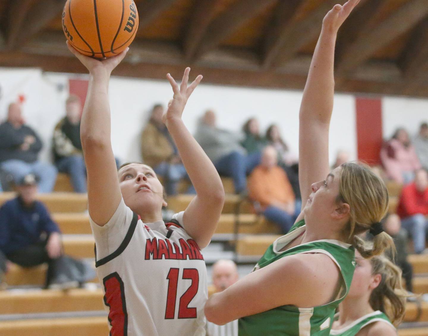 Henry-Senachwine's Kaitlyn Anderson lets go of a shot over Seneca's Tessa Krull on Monday, Jan. 13, 2024 at Henry-Senachwine High School.