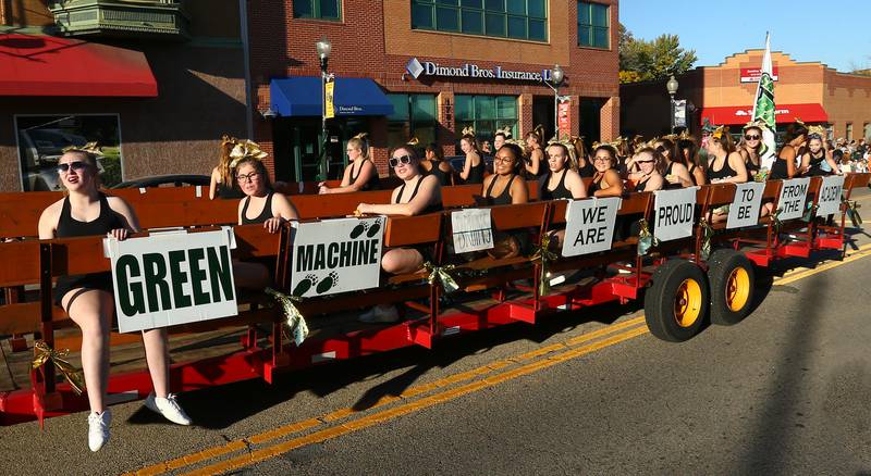 St. Bede cheerleaders ride on a float in the Homecoming parade on Friday, Sept. 30, 2022 downtown Peru.