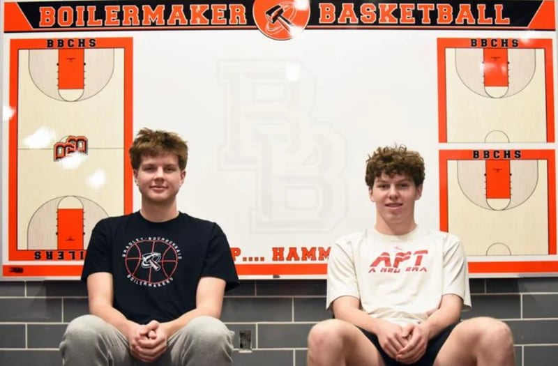Bradley-Bourbonnais senior Nick Allen, left, and junior Liam Martin sit in the boys basketball locker room. The two cousins are the starting frontcourt for this year’s Boilermakers squad.