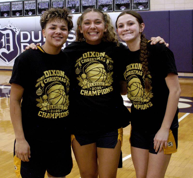 Joslyn James, sister Jaelynn and Brenley Johnson pose with their tourney shirts .The Sterling Golden Warriors played  the Byron Tigers in the championship game of the Dixon Holiday Tournament at Dixon High School on Monday, December 29th, 2025.
