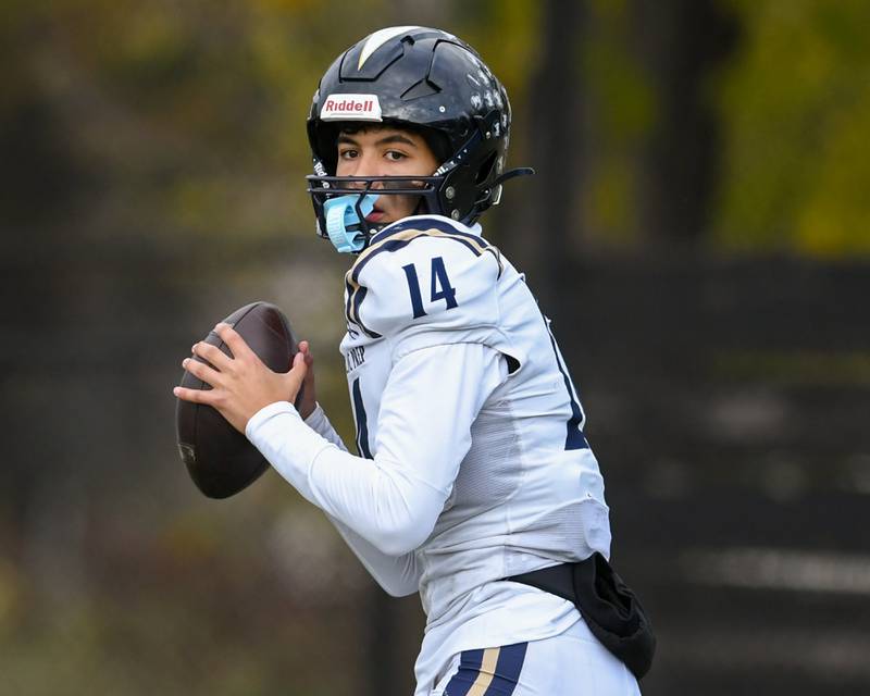 IC Catholic Prep's Alex Mitchell (14) looks to pass the ball during the 3A Playoff game against Chicago Hope Academy on Saturday Nov. 1, 2025, held at Altgeld Park in Chicago.
