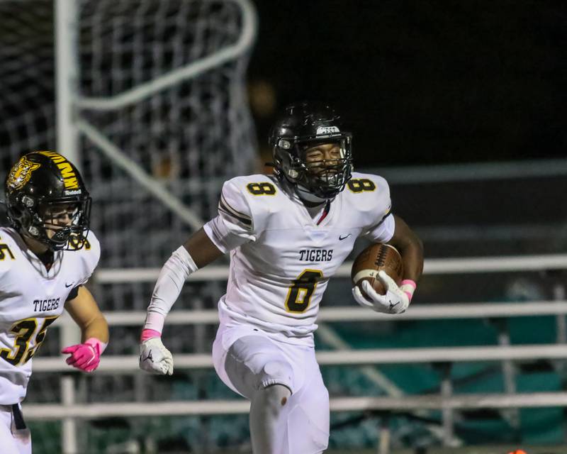 Joliet West's Micah Mcnair (8) celebrates a pick six during football game between Joliet West at Plainfield Central.   Oct 20, 2023.