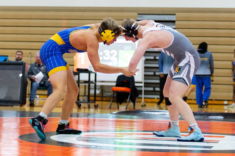Joliet Central's Xavier Eggert takes on Robert Vogel of Plainfield East in the 175-pound match at Plainfield East on Dec. 12, 2024.