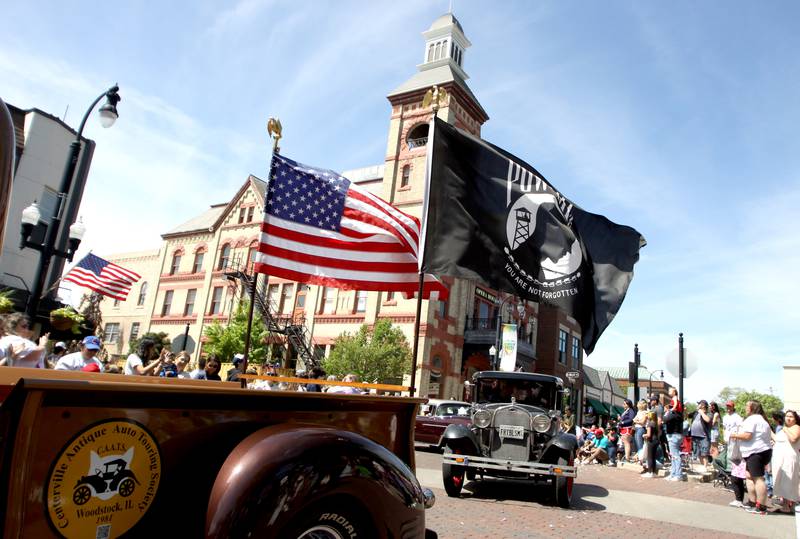 A Memorial Day parade enters the square in downtown Woodstock on Monday, May 26, 2025.