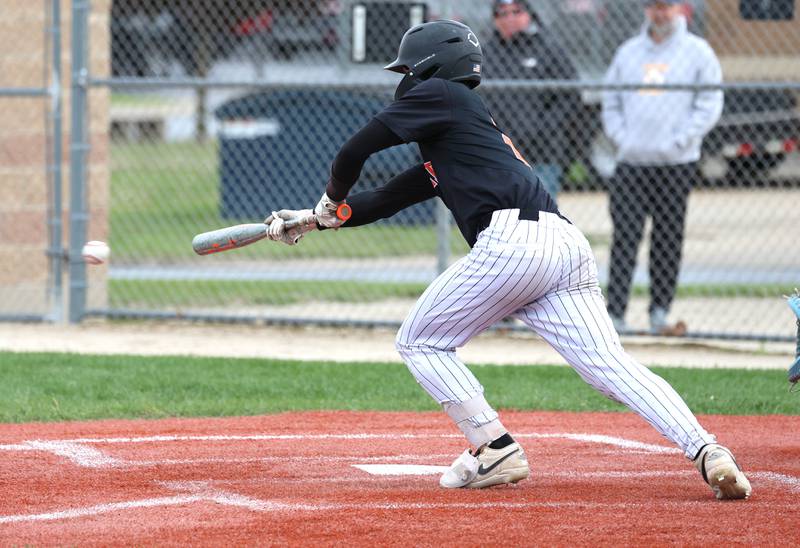 DeKalb's Gavin Cheney tries to get a bunt down Tuesday, May 5, 2026, during their game against Neuqua Valley at DeKalb High School.