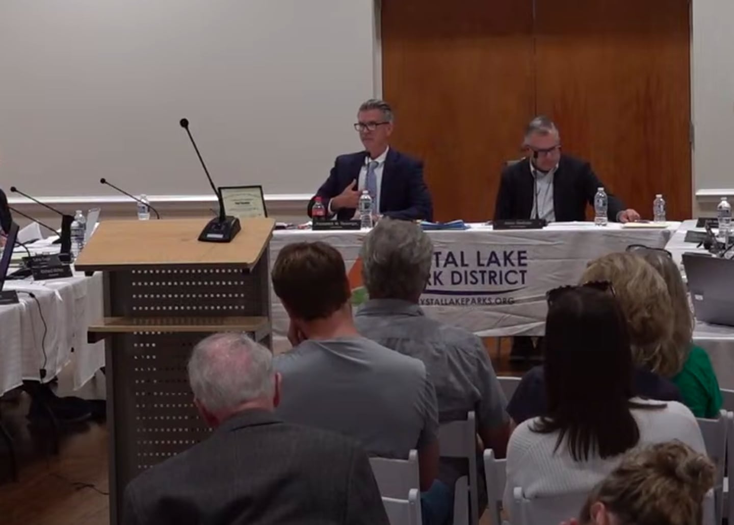 Crystal Lake Park District board President Frederick Tiesenga pats his chest while referencing the bullet-proof vest he said he was wearing during a Sept. 22, 2025 board meeting.