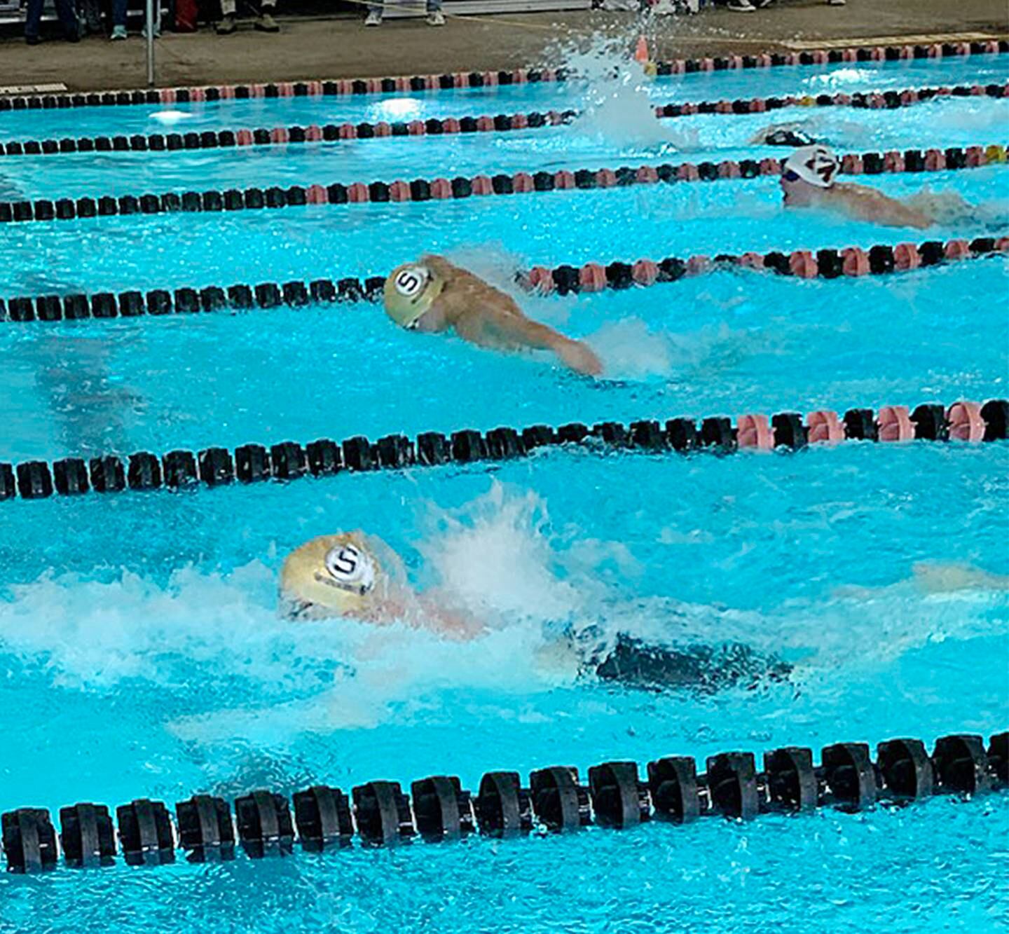 Sterling's Peter Garland (bottom) and Connor Pham swim side-by-side during the 100-yard butterfly at the United Township Sectional on Saturday, Feb. 18, 2023 in East Moline.