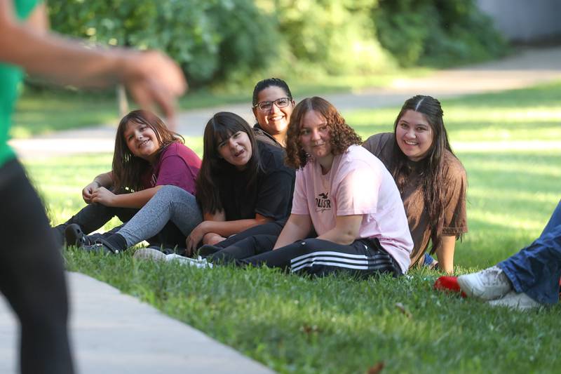 A group enjoys a skit performed by the GreenRoom Improv hosted by the Morris Library at Goold Park on Friday, Aug. 11, 2023 in Morris.