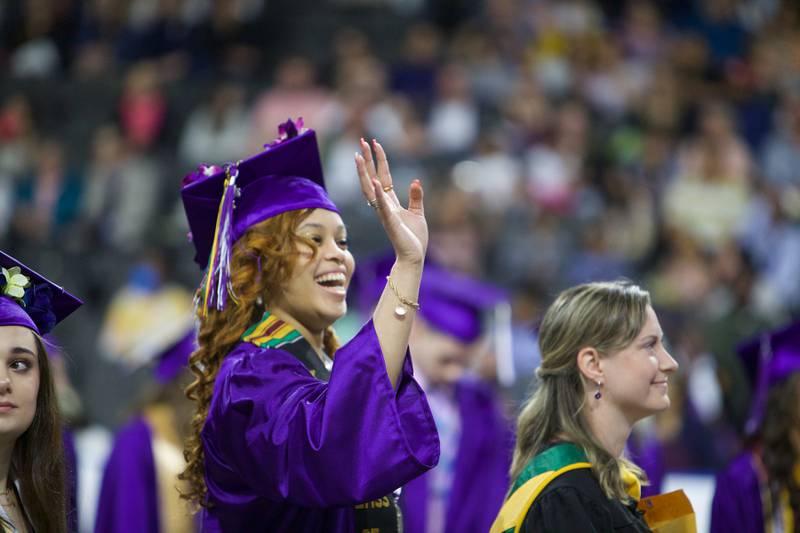 ZsuZsu Artelia Mack waves to family before the Hampshire High School graduation ceremony on May 21, 2022, at the NOW Arena in Hoffman Estates.