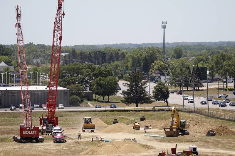 Construction equipment is seen at work during a ground breaking ceremony for a new Mercyhealth hospital at the intersection of Three Oaks Road and Rt. 31 on Wednesday, June 16, 2021 in Crystal Lake.