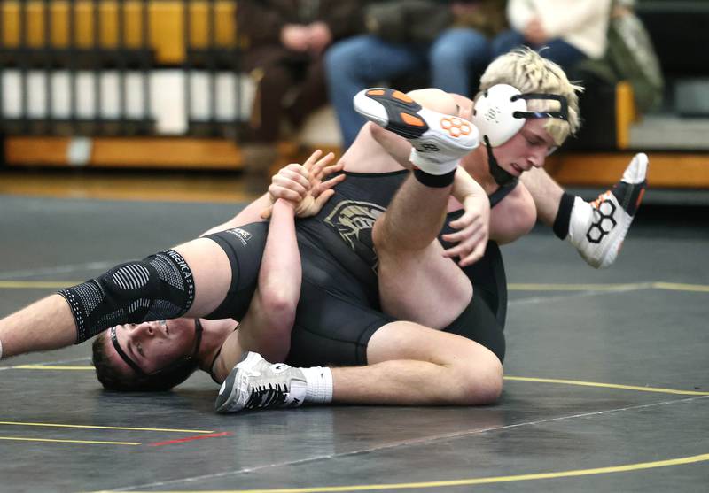 Sycamore’s Cooper Bode controls Kaneland’s Apollo Gochis during their 175 pound match Thursday, Jan. 9, 2025, at Sycamore High School.