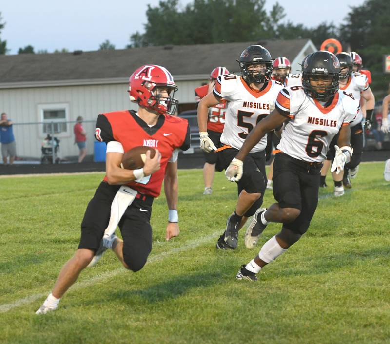 Amboy's Tucker Lindenmeyer turns the corner for a gain as Milledgeville's Micha Toms-Smith (6) and Cayden Akers (50) pursue on Friday. Sept. 9.