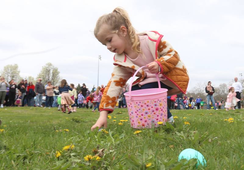Rosie Curley of Utica, collects eggs during the annual Easter egg hunt on Saturday, April 19, 225 at Carey Memorial Park in Utica.
