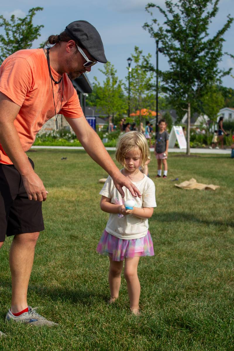 Alana Schall, 4, of Bourbonnais, competes in the egg relay at The Grove during the 5th annual Bourbonnais Food Truck Festival on Saturday, Aug. 16, 2025.