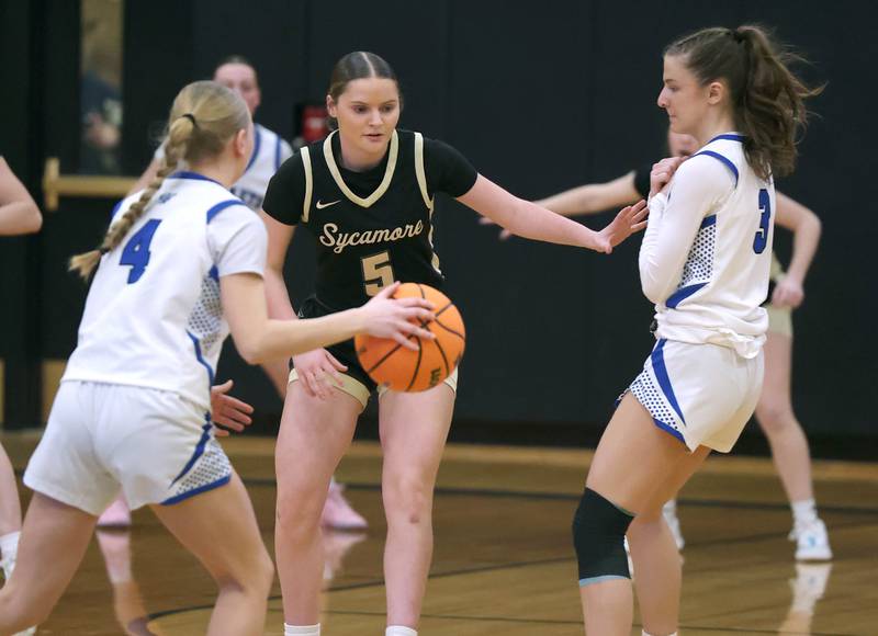 Sycamore's Grace Amptmann is screened by Burlington Central's Julia Scheuer as Burlington Central's Ashley Waslo handles the ball Thursday, Feb. 19, 2026, during their Class 3A regional championship game at Sycamore High School.