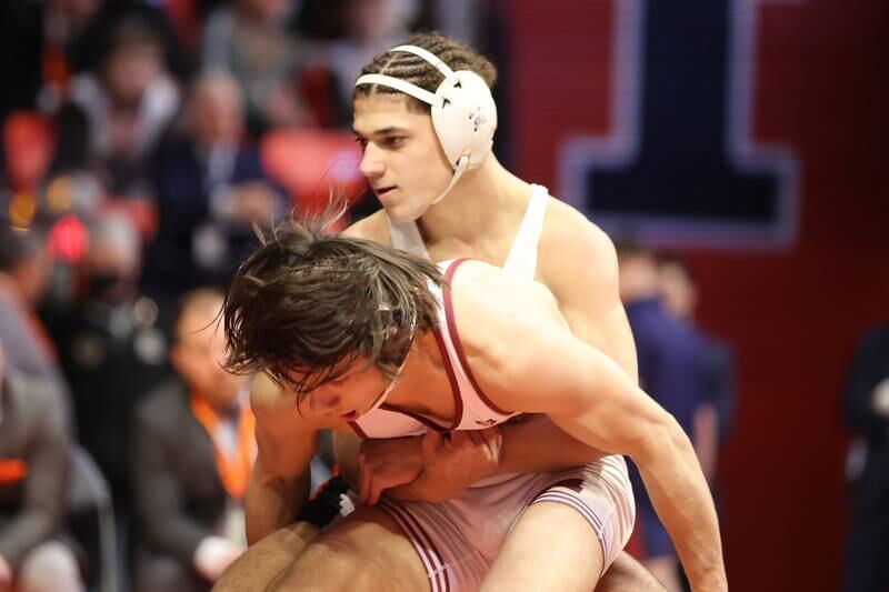 Dekalb’s Tommy Curran looks to bring down Moline’s Noah Tapia in the Class 3A 145lb. championship match at State Farm Center in Champaign. Saturday, Feb. 19, 2022, in Champaign.