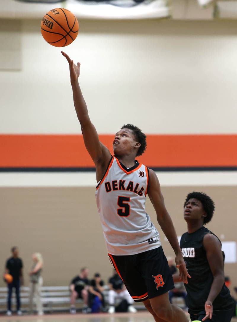 DeKalb’s Bryan Miller scores on a layup Friday, June 20, 2025, during their game against Streamwood in the DeKalb Live summer tournament at DeKalb High School.