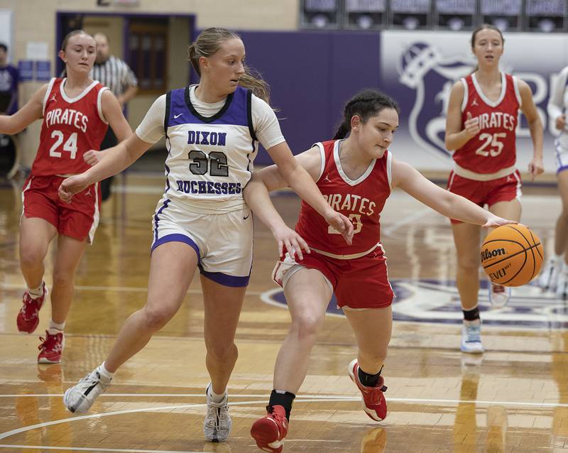Dixon’s Makenzie Toms puts defense on Ottawa’s Mary Stisser Wednesday, Dec. 4, 2024, at Dixon High School.
