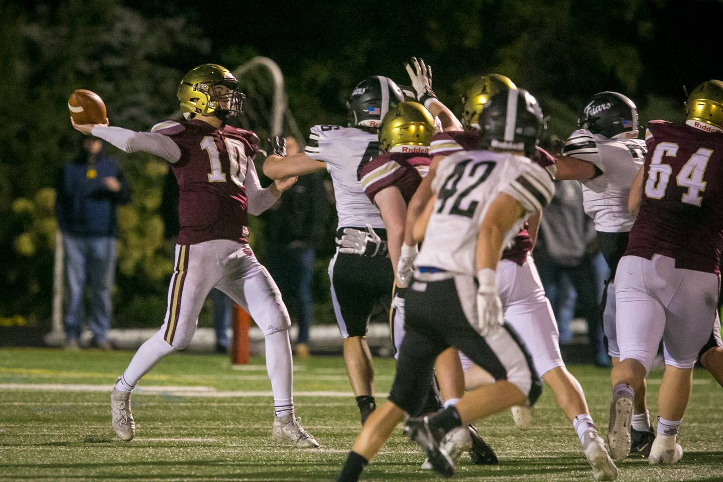 St. Ignatius quarterback Jake Petrow (10) passes the ball during the fourth quarter of the football game at Saint Ignatius College Prep on Friday, Oct. 22, 2021. The Wolfpack lost, 28-20.