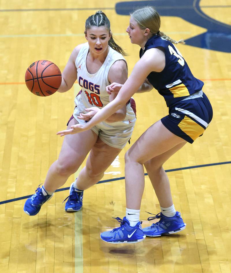 Genoa-Kingston's Elizabeth Davis drives around Polo's Syndei Rahn during their game Monday, Jan. 29, 2024, at Genoa-Kingston High School.