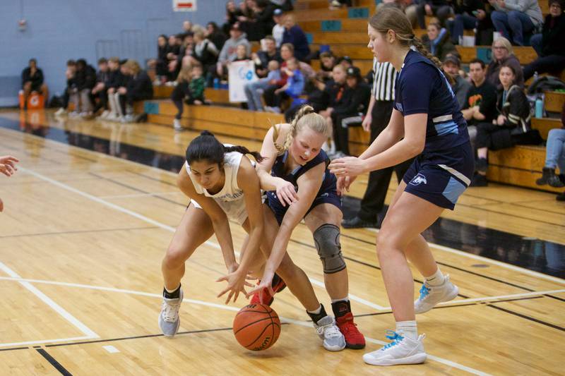 Willowbrook's Yasmine Seataram battles for the loose ball with Downers Grove South's Victoria Teper on Friday, Feb.3,2023 in Villa Park.