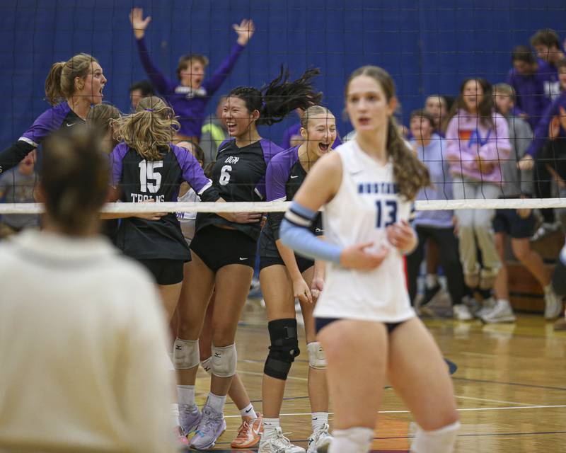 Downers Grove North celebrates their win over Downers Grove South in the Class 4A Lyons Sectional Semifinal volleyball match. Nov 4, 2025 in La Grange.