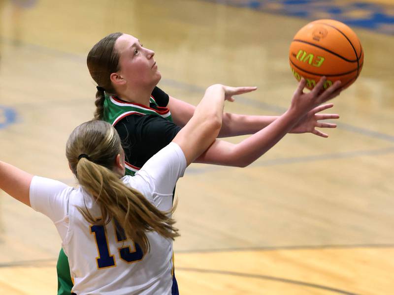 La Salle-Peru's Alexus Hines is fouled by Somonauk-Leland's Kiley Mason as she goes to the basket during their game Thursday, Nov. 20, 2025, in the Tim Humes Breakout girls basketball tournament at Somonauk High School.