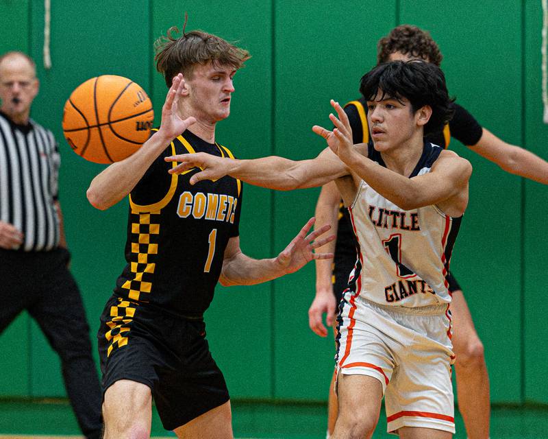 Pedro Lopez (1) of DePue passes ball to teammate whilst Matt Kuban (1) of Reed-Custer defends during game in the Shipyard Showdown on Tuesday, December 23, 2025 at Seneca High School in Seneca.