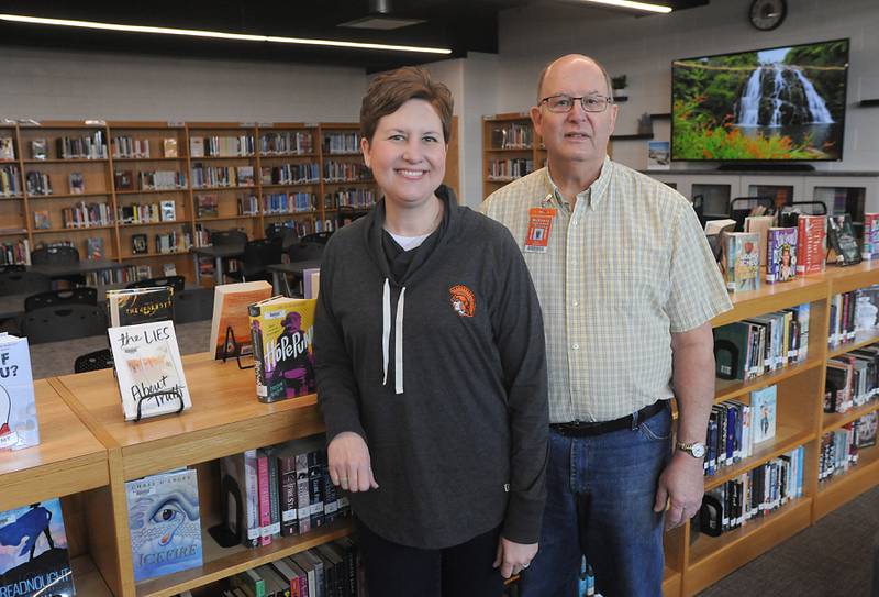 Teachers Erin Harris, left, and her father, teacher Bruce Montressor, at McHenry High School’s Freshman Campus. Harris is the daughter of two teachers and has never been without a parent at school. 
Her mother, Maureen Montressor, is a teacher at Montini Catholic School in McHenry.