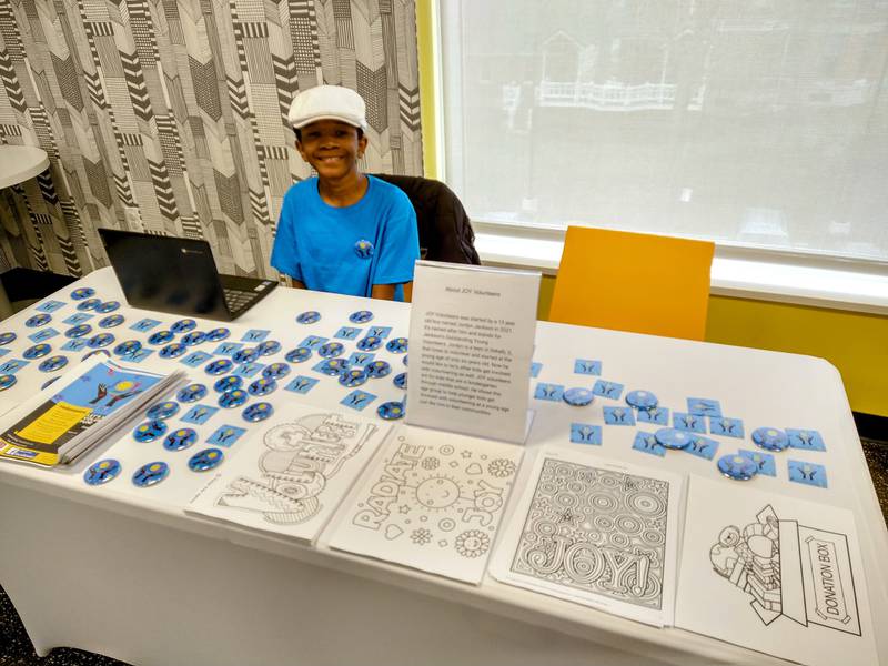 Jordyn Jackson, 14, started JOY - Jackson's Outstanding Young Volunteers, which organizes volunteering events and inspires children to get involved in the community. Jackson held his own booth at the DeKalb Public Library's volunteer fair on March 26. Photo provided by Jackson's mother, Angela Johnson.