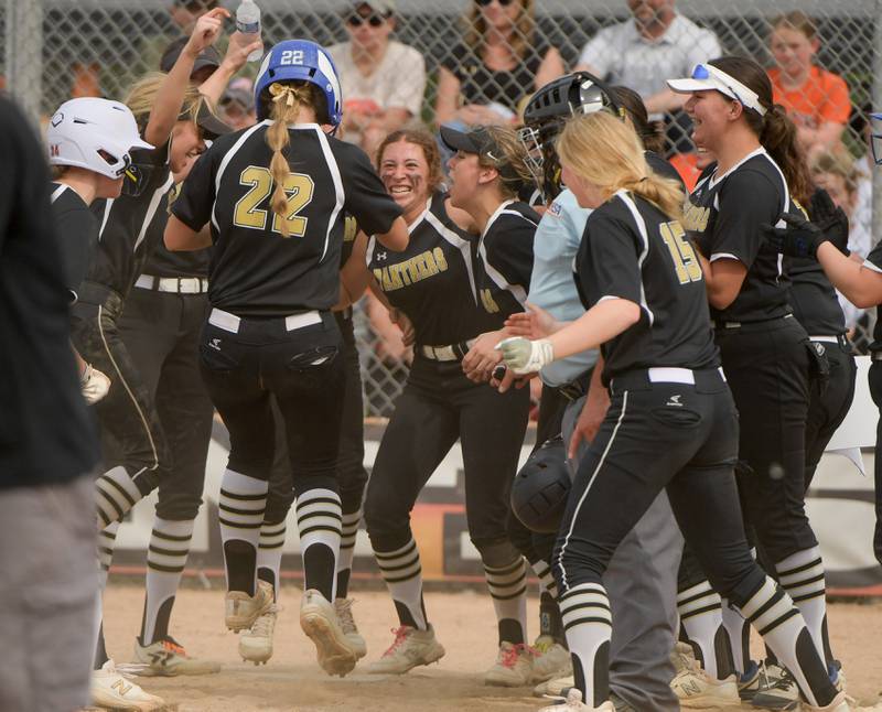 Glenbard North celebrate Liz WelchÕs game winning two run home run against the St. Charles East in the seventh inning of the Class 4A St. Charles East Sectional semifinal on Tuesday, May 31, 2022.