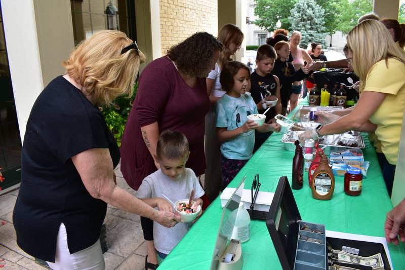Children make their ice cream choices at last year's Grundy Bank Ice Cream Social.