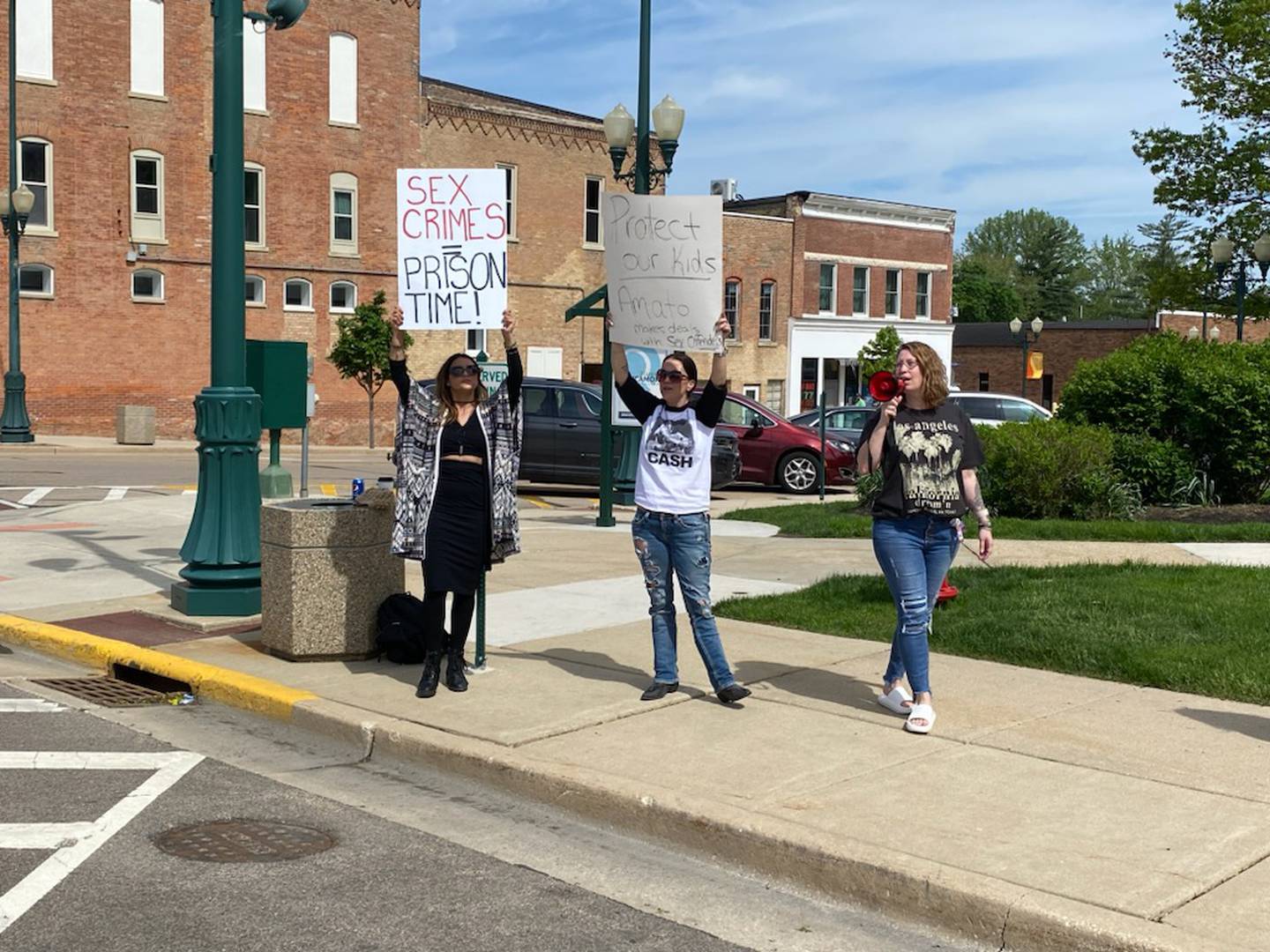 A handful of women gathered along Main Street outside the DeKalb County Courthouse in Sycamore Monday, May 15, 2023. The women expressed solidarity for Gracie Sasso-Cleveland, 15,  a slain DeKalb High School freshman who's death is at the center of murder charges for 29-year-old Timothy M. Doll, of DeKalb, a registered sex offender. The women called for stricter Illinois laws against sex offenders.