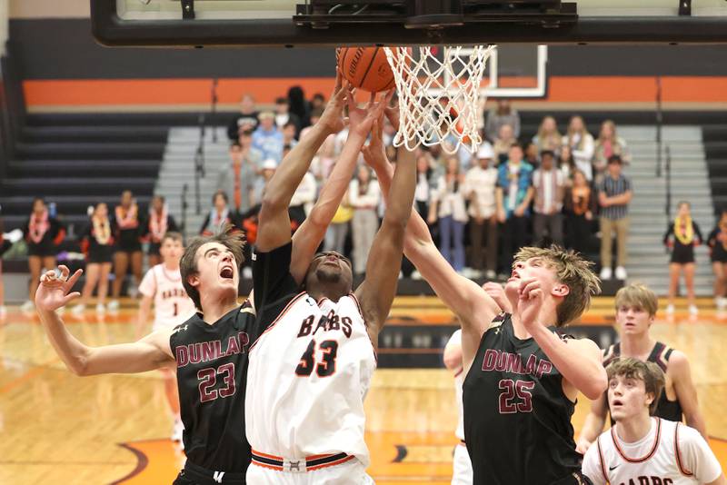 DeKalb's Chance Perry goes after a rebound between Dunlap's Ryan DiGiallonardo and William Sutter during their game Monday, Nov. 21, 2022, at DeKalb High School.