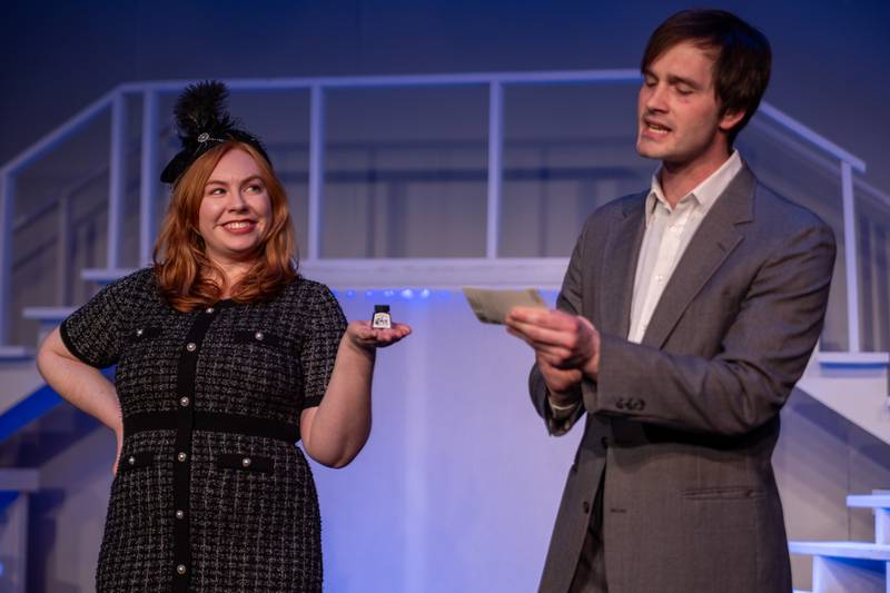 Ensemble cast member Laura Wilson displays product for “Frank Abagnale Jr.” (Played by Payton Drake) on Monday, March 24, 2025 at River Valley Players Theatre in Henry.