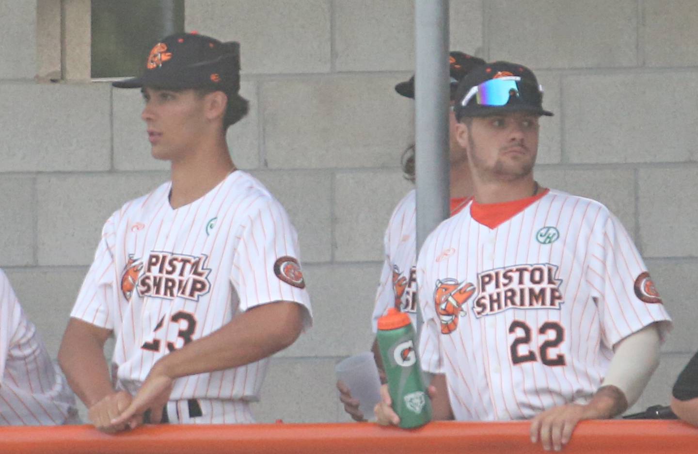 Jared Herzog and Taylor Waldron both of Ottawa, stand next to each other in the Pistol Shrimp dugout during the home opener in Schweickert Stadium on Thursday, May 30, 2024 at Veterans Park in Peru.