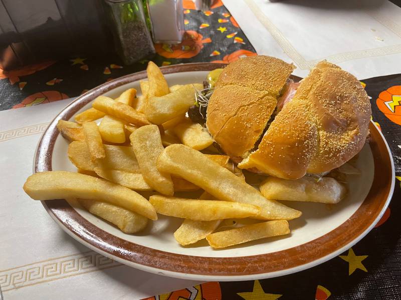 The Cheeseburger in Paradise, a staple at the 9th Street Pub in La Salle. The burger doesn't come cut in half. Mystery Diner cleaved it in half so his dining companion could enjoy this big-enough-to-split burger.