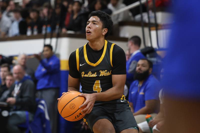 Joliet West’s Brockton Goehrke looks to take the outside shot against Joliet Central on Thursday, Jan. 15, 2026 in Joliet.