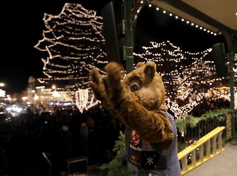 Woodstock Willie waves to the crowd during the Lighting of the Square on Friday, Nov. 28, 2025, in Woodstock.The annual holiday season event featured brass music, caroling, free doughnuts and cider, food trucks, festive selfie stations and shopping.