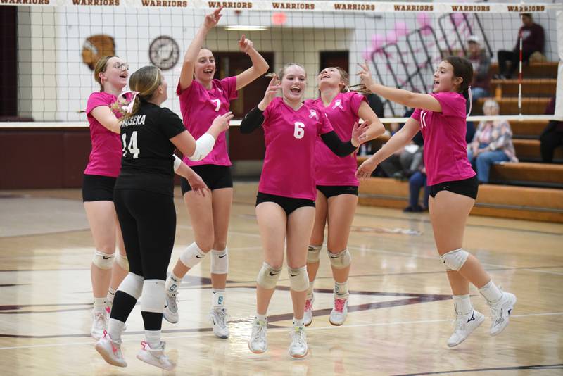 Members of the Watseka girls volleyball team celebrate after scoring a point during a home game against Cissna Park Tuesday, Oct. 21, 2025.