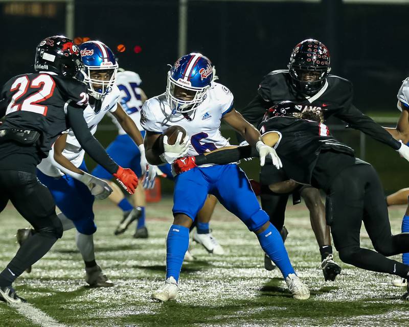 Glenbard South's Carter London (6) is tackled after running back the kickoff during football game between Glenbard South at Glenbard East.   Oct 13, 2023.