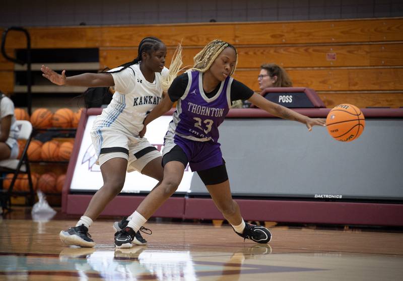 Kankakee's London Stroud, left, pressures Thornton's Deasia Stamps, right, in a game on Thursday, December 4, 2025.