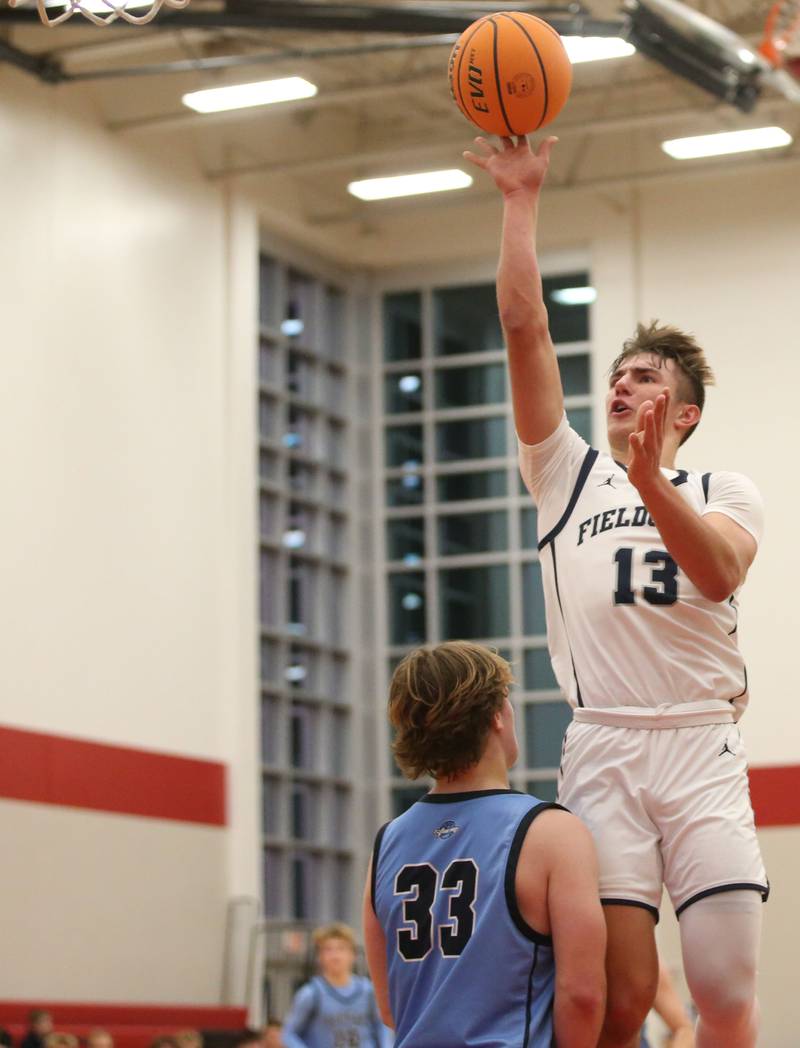 Fieldcrest's Layten Gerdes shoot a jump shot over Bureau Valley's Elijah Endress during the 50th annual Colmone Classic on Monday, Dec. 9, 2024 at Hall High School.