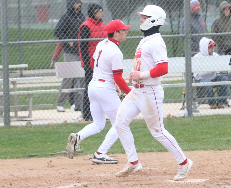 Ottawa's Adam Swanson steps on home plate to score a run against Hall on Tuesday, April 1, 2025 at Ottawa High School.